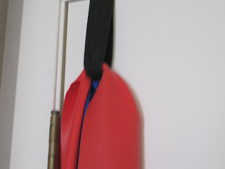 Red and blue paddle with black strap.