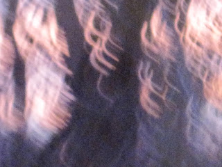 Blurry abstract image with light streaks.