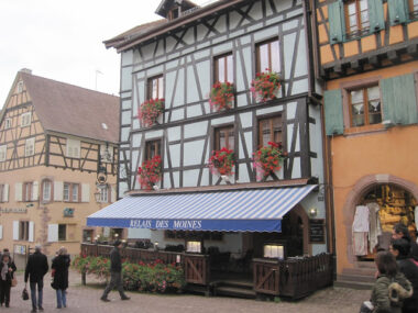 Half-timbered building with flower boxes.