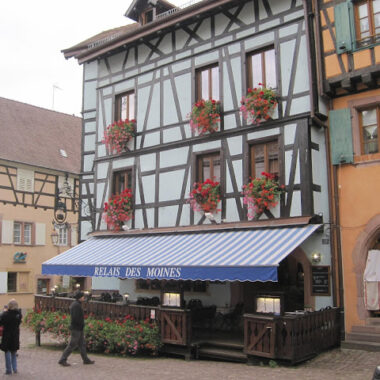 Half-timbered building with flower boxes.
