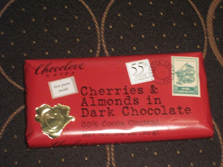 Red chocolate bar with cherries and almonds.