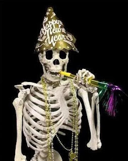 Skeleton celebrating New Year with party hat.