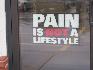 Sign reading "Pain is not a lifestyle.
