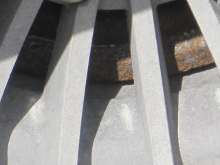 Metallic structure with visible rusted parts.