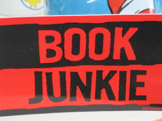 Book Junkie" text on red background.