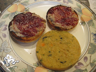 Toasted bagel with jam and cornbread.