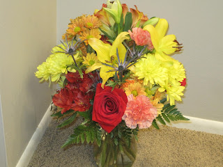 Colorful bouquet with roses and lilies.