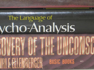 Stack of books on psychoanalysis topics.