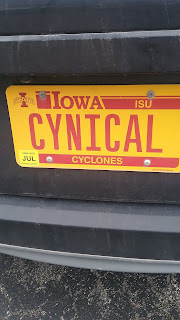 Iowa license plate with "CYNICAL" text.