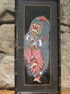 Framed artwork of traditional Balinese Barong dancer.