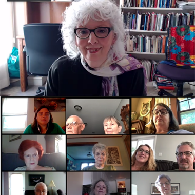 Video call with multiple participants on screen.